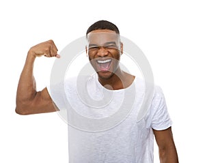 Happy african american man flexing arm muscle