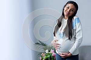 happy african american pregnant woman
