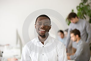 Happy african-american professional manager smiling looking at c