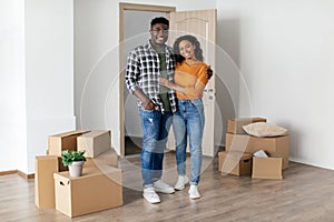 Happy African American Spouses Hugging Posing Moving New House