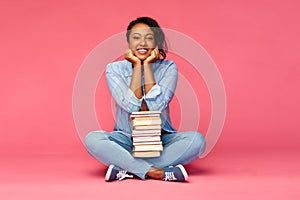 Happy african american student woman with books