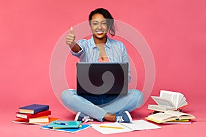 Happy african american student woman with laptop