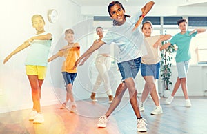 Happy african american tween boy practicing energetic dance