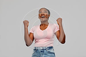 Happy african american woman celebrating success