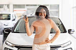 Happy African American Woman Holding Keys Of Her New Car After Buying