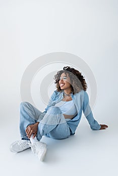 happy african american woman in jeans