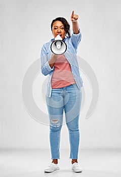 Happy african american woman over grey background