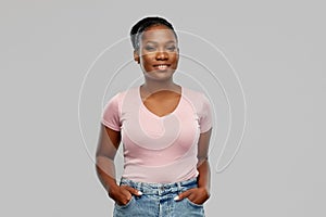 Happy african american woman over grey background