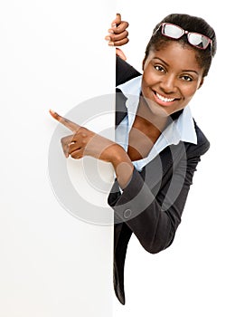 Happy African American Woman pointing at billboard sign white ba