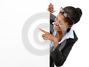 Happy African American Woman pointing at billboard sign white background