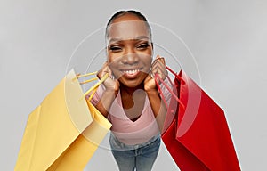 Happy african american woman with shopping bag