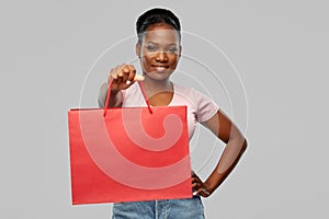 Happy african american woman with shopping bag