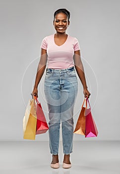 Happy african american woman with shopping bags