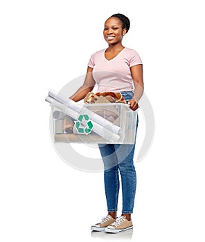 happy african american woman sorting paper waste