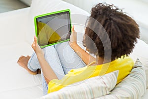 Happy african american woman with tablet pc