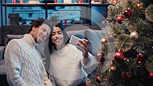 happy african american woman taking selfie