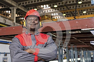 Happy African American Worker In Personal Protective Equipment Looking At Camera