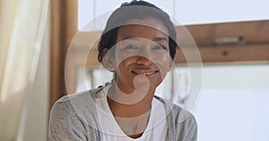 Happy african american young woman at home close up portrait