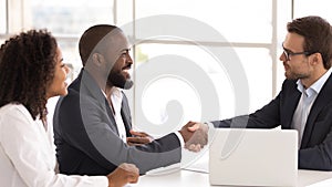 Happy african couple shake hand of insurer buy insurance services