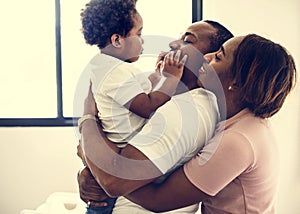 Happy african descent family at home