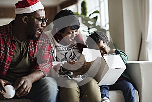 Happy African family celebrating christmas