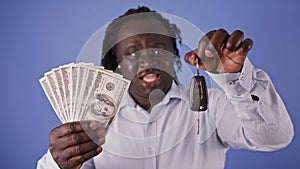 Happy African Man with Car Key and Money - US Dollars - Selling Buying a car