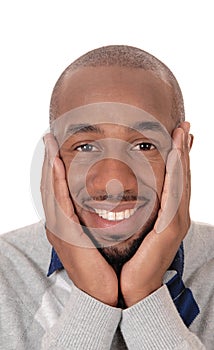 Happy African man with hands on his face