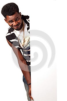 Happy African man holding empty bill board
