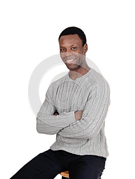 Happy African man smiling, sitting