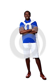 Happy african man standing with arms folded