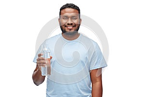 Happy african man with water in glass bottle