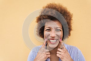 Happy african senior woman smilng on camera outdoor - Focus on face