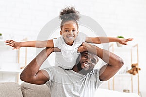 Happy afro family having fun together at home