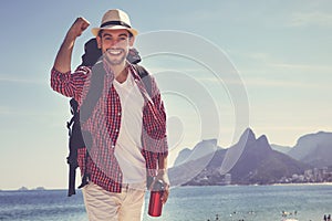 Happy american hipster tourist at Ipanema beach at Rio de Janeiro
