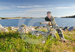 Happy angler in beautiful scenery