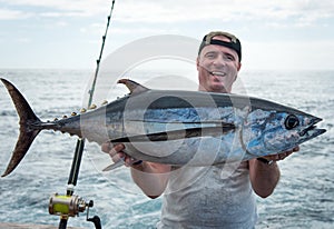 Happy angler with big tuna
