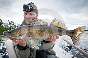 Happy angler with big zander