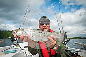 Happy angler with lake trout