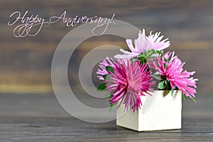 Happy Anniversary card with flowers arranged in gift box