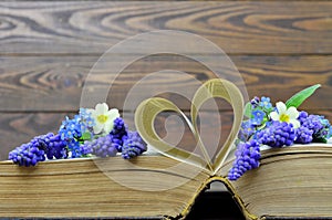 Happy Anniversary card with flowers and heart shaped book pages