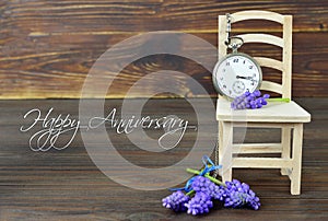 Happy Anniversary card with pocket watch and flowers