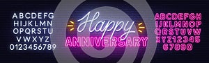 Happy anniversary neon text. Greeting card on brick wall background. Pink and white neon alphabets.