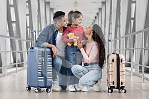 Happy Arab Family Of Three Bonding At Airport While Waiting For Flight