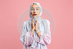 Happy arab woman in hijab. Portrait of smiling girl, posing at studio background