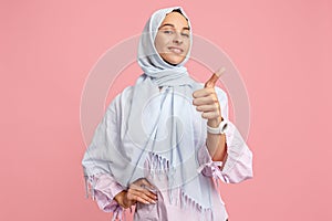 Happy arab woman in hijab. Portrait of smiling girl, posing at studio background