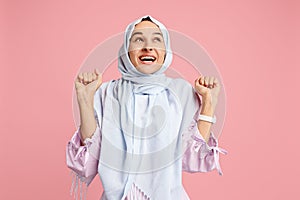 Happy arab woman in hijab. Portrait of smiling girl, posing at studio background