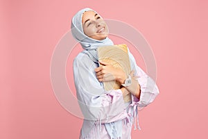 Happy arab woman in hijab. Portrait of smiling girl, posing at studio background