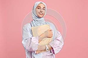 Happy arab woman in hijab. Portrait of smiling girl, posing at studio background