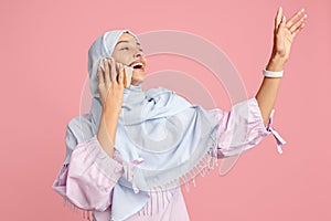 Happy arab woman in hijab. Portrait of smiling girl, posing at studio background