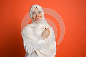 Happy arab woman in hijab. Portrait of smiling girl, posing at studio background